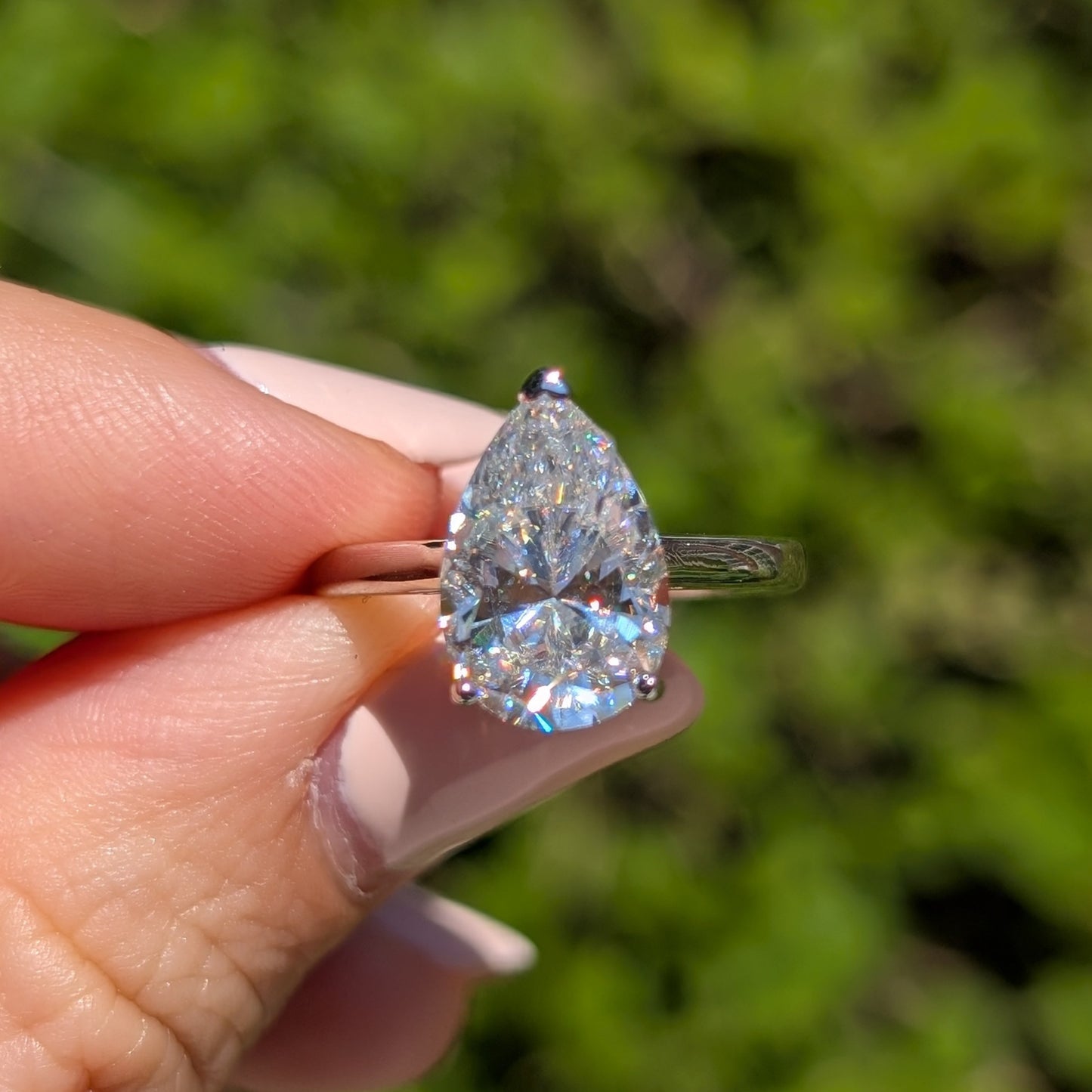 The Beloved Grande — 4CT Pear Cut Moissanite Ring | Heart Detail Band